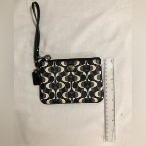 Coach. Women. Wristlet. used once. 2 tandem open pockets inside.